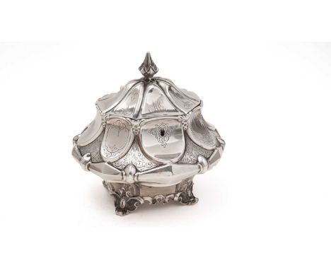 A large Victorian silver tea caddy, shaped oval in form with alternating engraved reserves and tongue-shaped panels around th