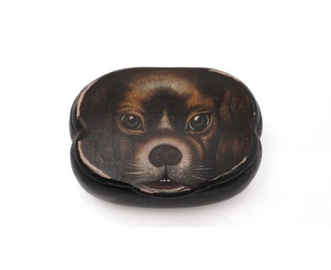 A mid 19th Century papier-mache snuff box, cartouche-shaped, painted on the cover in polychrome with the portrait of a dog, (
