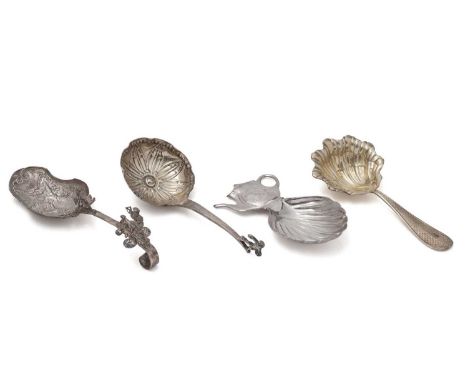 Four caddy spoons: a late 19th Century French silver gilt example, maker's mark "H C", Paris post 1838, a Dutch decorative si