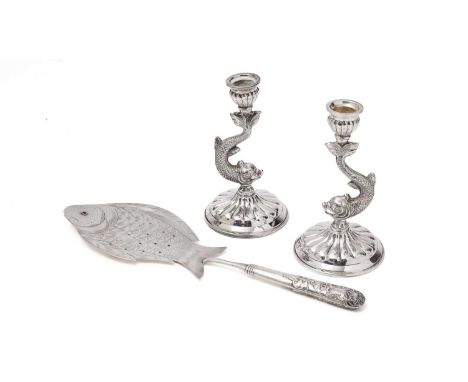 A pair of mid 20th Century Spanish silver candlesticks on domed circular bases, with fluted decoration and columns in the for