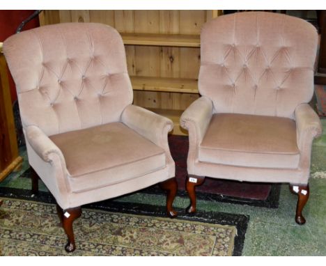A button upholstered wingback armchair by Wade Furniture; a conforming armchair. (2)