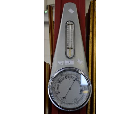 A 1950's barometer, by Sestrel, signed, silvered circular dial, surmounted by a thermometer, cold painted case 