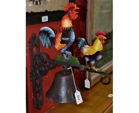 A cast iron cockerel bell; a cockerel wall hanging bracket (2).