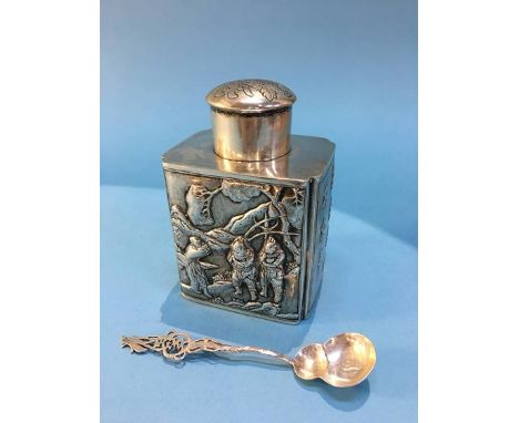 An Oriental white metal tea caddy, decorated with embossed dragons, marked 'Tuchchang' to base together with a spoon, 219g