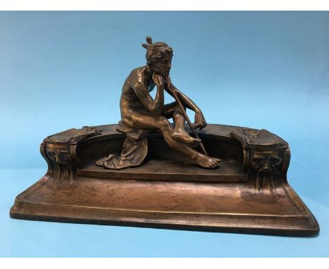 A good quality bronze inkwell in the form of Hermes holding a scroll sat on a bench