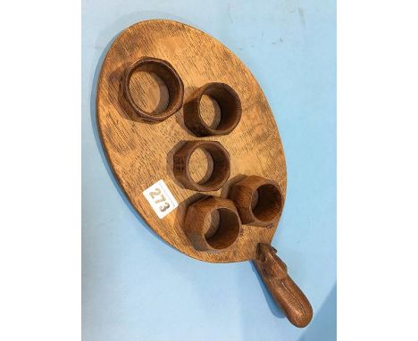 Robert 'Mouseman' Thompson oak breadboard and two napkin rings, together with three other 'Yorkshire' oak napkin rings