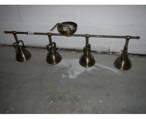 A 4 lamp adjustable ceiling light (all angles).