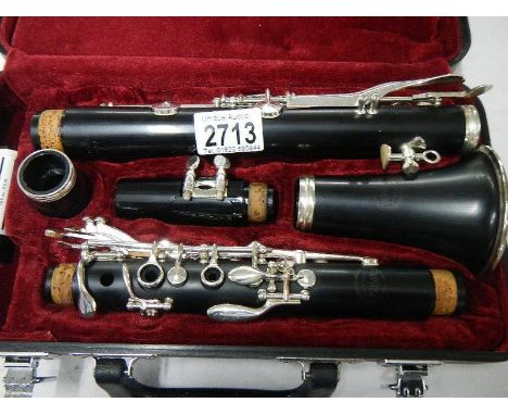 A good quality silver plated "Jupiter" cased clarinet with spare reed.