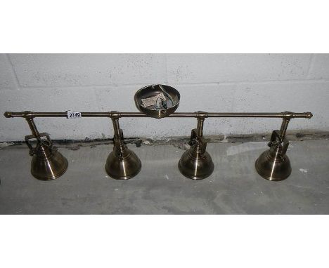A 4 lamp adjustable ceiling light (all angles).