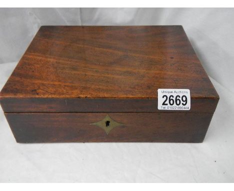 A Victorian mahogany writing slope (needs inner shelf),