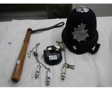 A collection of 20th century police memorabilia including hand cuffs, trucheon,helmet etc.,