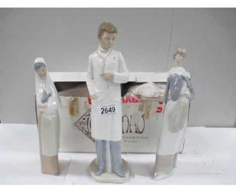 3 NAO figures including Doctor (with box), Lady with head scarf, and Lady with Rabbit