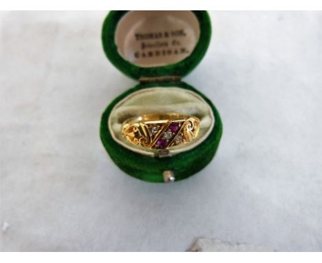 An Edward VII ruby and diamond five stone ring. In gold marked 18ct. Birmingham 1901. 3.1g gross. Size K