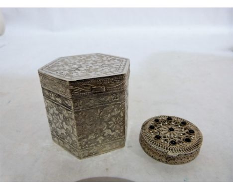 A continental silver hexagonal box, all over chased with foliage, 2¼'' high and a silver filigree stone set patch box marked 