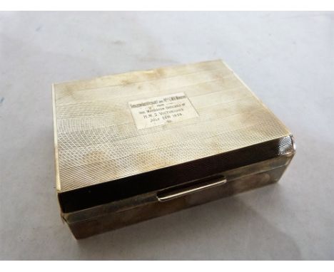 An Elizabeth II silver engine turned cigarette box. Cedar lined. 4¼'' wide. Birmingham 1954. Dents