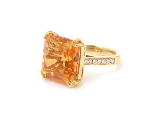 A citrine and diamond ring, the square step cut citrine measuring 15.0 x 14.7 x 9.9mm estimated to weigh 10.39carats, double 