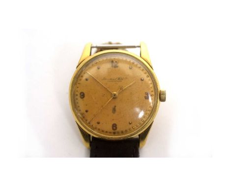 International Watch Co (IWC): an 18ct yellow gold-cased wristwatch, the gilt dial with arabic quarters and dot numerals and c