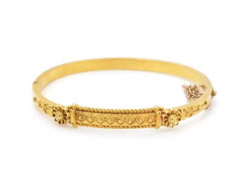 A Victorian 15ct yellow gold bangle, of Etruscan revival design, 6.2cms wide, 8.6g.