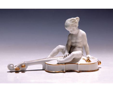 Porzellanfigur 'Cellist', Rosenthal, um 1920,  kleine Putte auf einem, Cello sitzend, Goldstaffage, Entw., Ferdinand Lieberma