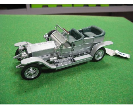 A Franklin Mint 1:24th Scale Diecast Model 1907 Rolls Royce Silver Ghost, model has previously been displayed, missing litera