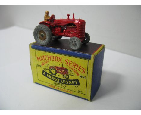 A Moko Matchbox 1-75 No 4 Massey Harris Tractor, with mudguards, fawn driver, gold rear wheels, very good, boxed.