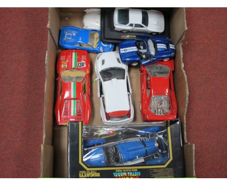 A Quantity of 1/18 and 1/24 Scale Diecast Vehicles by Burago and Others, one boxed, some damages noted.
