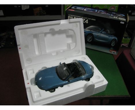 A Kyosho 1:12th Scale Diecast Model BMW Z4, dust to model interior noted, boxed.