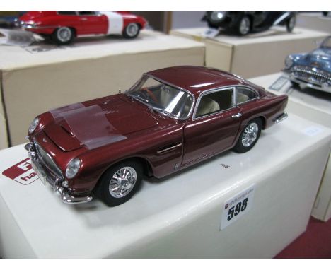 A Danbury Mint 1:24th Scale Diecast Model 1964 Aston Martin DB5, appears as new boxed.