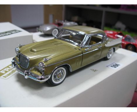 A Danbury Mint 1:24th Scale Diecast Model 1957 Studebaker Golden Hawk, appears as new, boxed.