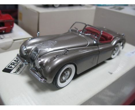 A Danbury Mint 1:24th Scale Diecast Model 1949 Jaguar XK120, appears as new, boxed.