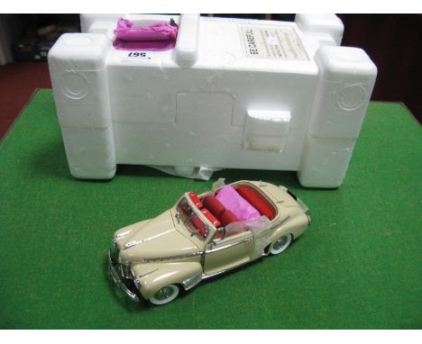 A Danbury Mint 1:24th Scale Diecast Model 1941 Cameo Cream Special Deluxe Convertible, missing literature and outer box.