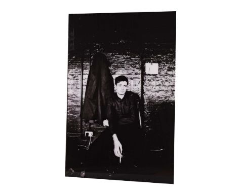 IAN CURTIS KEVIN CUMMINS PORTRAIT. A mounted photographic print of Ian Curtis in studio setting. Made for the Joy Division Ex