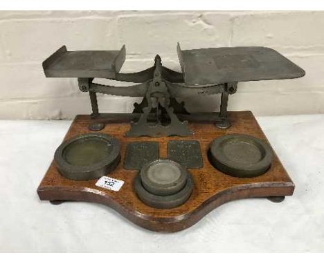 A set of antique postal scales with weights 