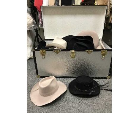 A metal trunk of cow boy hats 