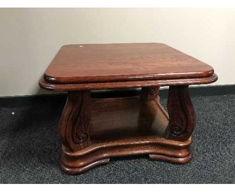 A reproduction mahogany lamp table 