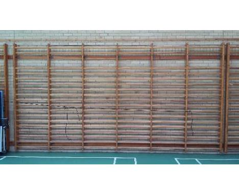 Six gymnasium wooden ladder wall systems comprising of 4 x six-ladder units each approximately 5.05m x 2.60m, and 2 x four-la