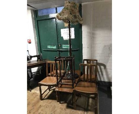 An oak standard lamp, stick stand, four chairs and a coffee table 