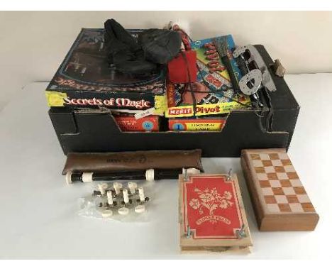 A box of vintage board games, Yamaha recorder, ice skates, etc 