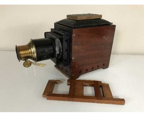 A vintage wooden cased Magic Lantern 