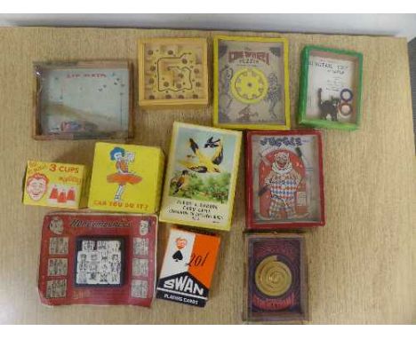 A box of vintage games and puzzles, playing cards etc, together with an Ever Ready radio receiver in case