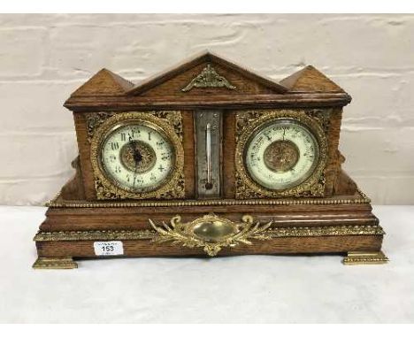 An antique oak bracket clock with gilt and enamelled dial, fitted with a barometer, with ormolu mounts 