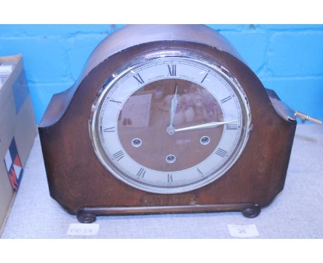 A wooden cased 1930's mantle clock, shipping unavailable 
