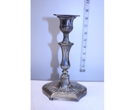 A hallmarked silver loaded candlestick 