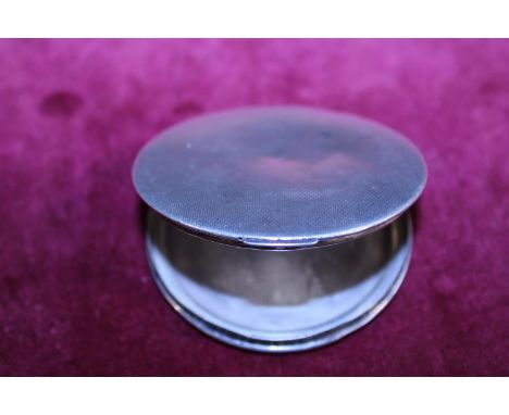 A large silver compact 