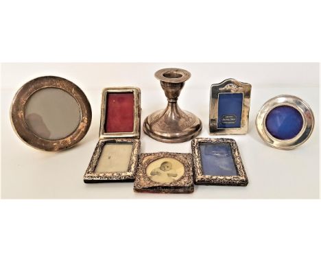 SELECTION OF SEVEN SILVER SMALL PHOTOGRAPH FRAMESand a Walker and Hall chamber stick, most with rubbed marks (8) 