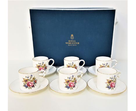 ROYAL WORCESTER BOXED COFFEE SETcomprising six cups and saucers, decorated with flowers and gilt highlights 