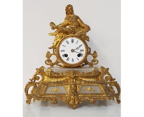 20th CENTURY FIGURAL MANTLE CLOCKwith a circular enamel dial with Roman numerals and an eight day movement, the case with ala