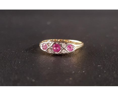 RUBY AND DIAMOND RINGthe three graduated rubies separated by small diamonds, on eighteen carat gold shank, ring size O 