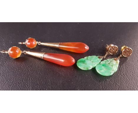 PAIR OF CARVED JADE DROP EARRINGSthe jade sections suspended below Chinese character decoration, with fourteen carat gold but