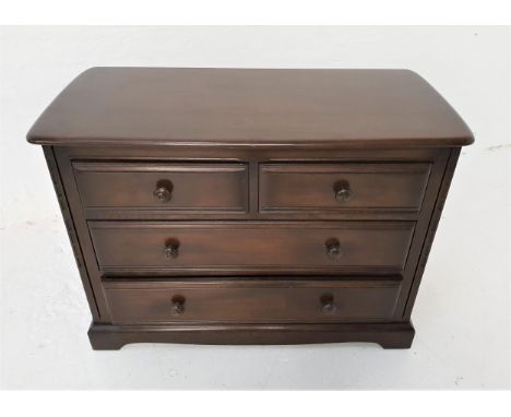 ERCOL DARK OAK CHESTwith two short drawers above two long drawers, standing on bracket feet, 72cm x 102cm 